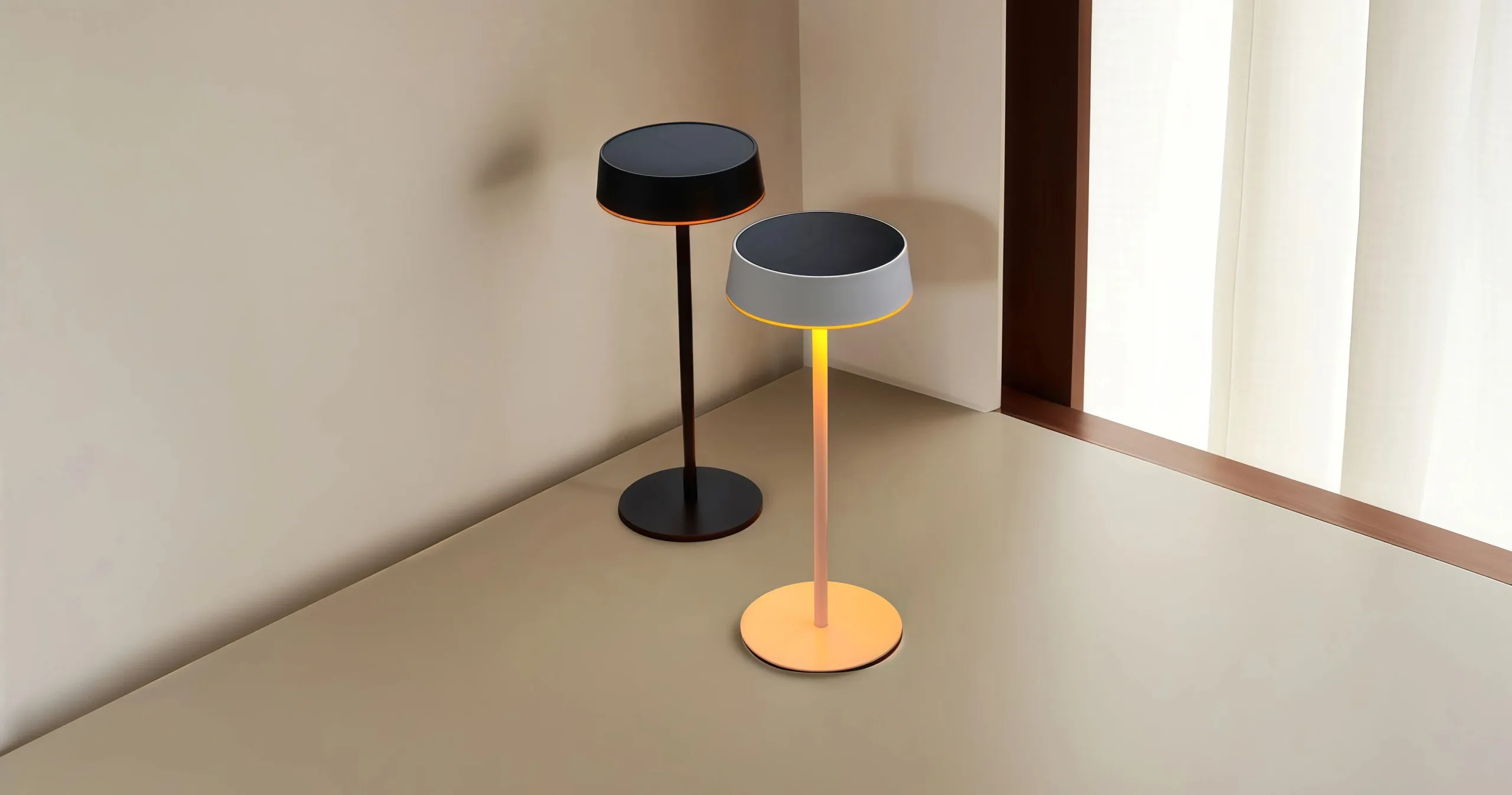 Studio shot of black and white minimalist solar table lamps against a clean beige background, highlighting the flat top solar panel and thin stem.