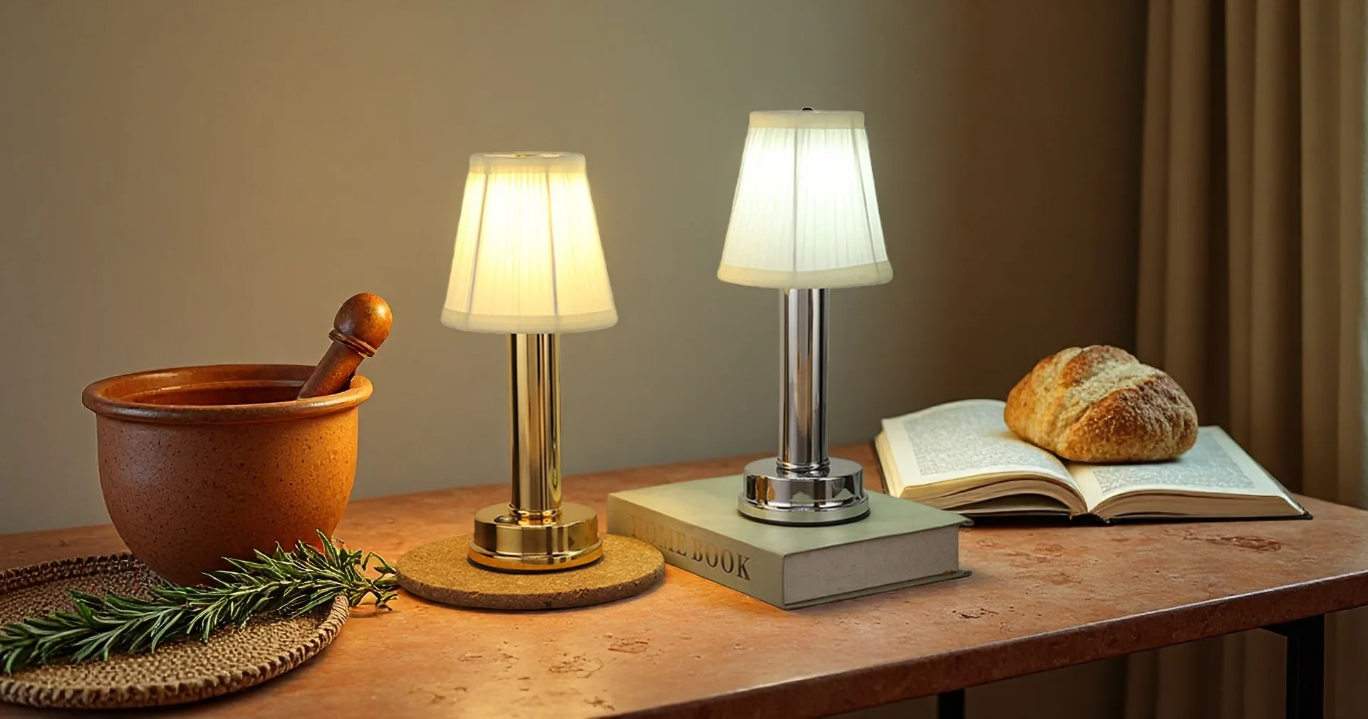 Gold rechargeable table lamp with fabric shade on a bedside table